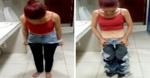 Graban a la mujer que intentó robar 8 pantalones en una tienda usándolos a la vez