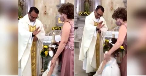 La niña reacciona cuando el sacerdote le iba a dar la bendición desconcertando a todos