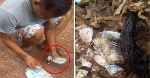 Un trabajador ayuda a una familia a recuperar una bolsa llena de dinero entre la basura