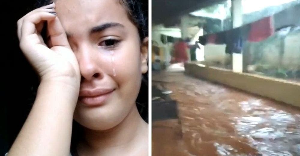 Una niña llora al mostrarle a su profesor los daños que sufrió su casa el día de su cumpleaños